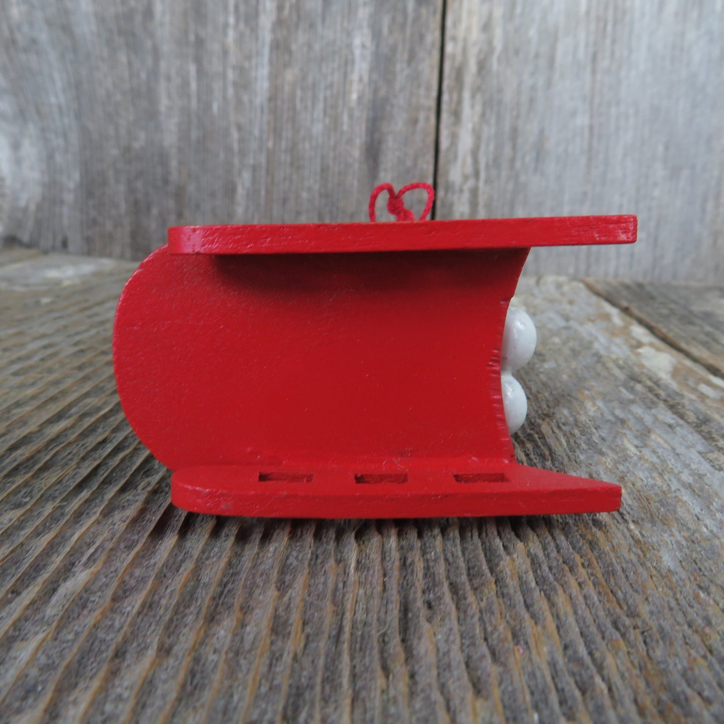 Vintage White Seal on Sled Wood Ornament Red Hat Green Scarf Red Sled Christmas