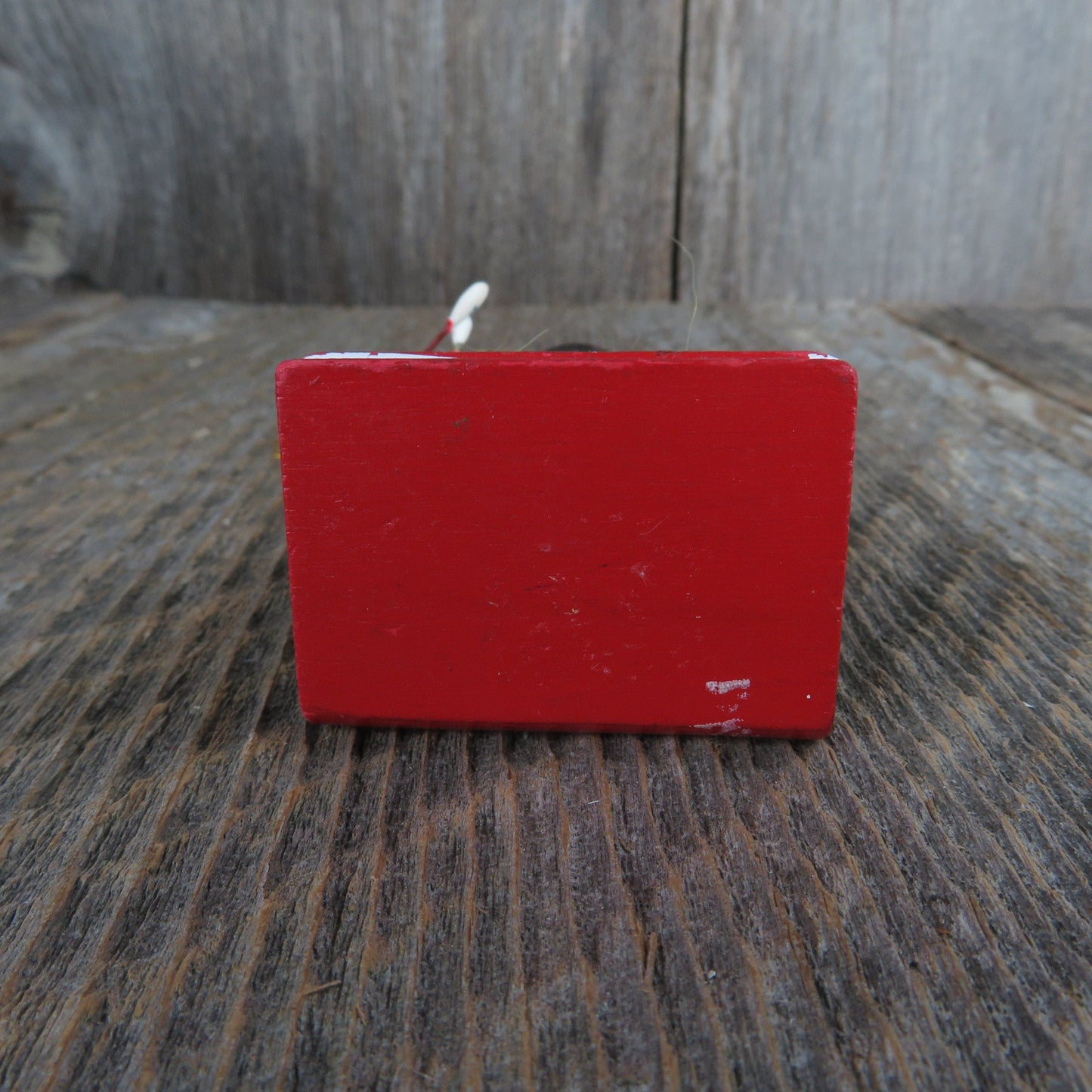 Vintage Snowman Holding Marshmallows Wood Ornament Yellow Scarf Black Hat and Vest Standing On Books Wood Christmas