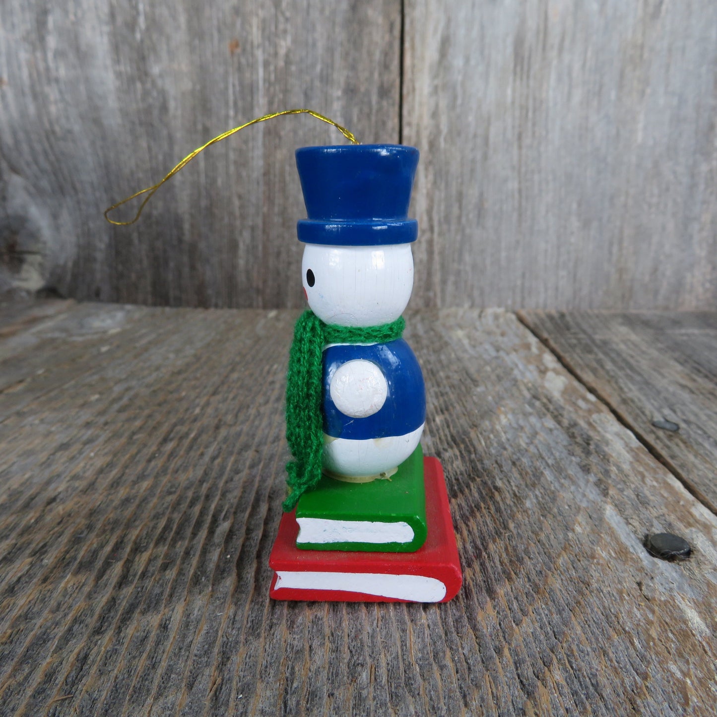 Vintage Snowman in Scarf and Blue Hat Wooden Ornament Standing On Books Wood Christmas Green Scarf Blue Vest