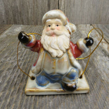 Load image into Gallery viewer, Swinging Santa Christmas Ornament Pottery Set Glazed Ceramic Red Blue Gloss - At Grandma&#39;s Table