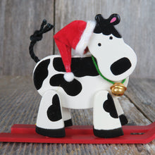 Load image into Gallery viewer, Vintage Cow On Skis Ornament Wooden Avon Christmas Holstein Black White Red Santa Hat Wood Country Rustic