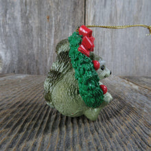 Load image into Gallery viewer, Vintage Raccoon in Wreath Ornament Christmas Resin Green Red