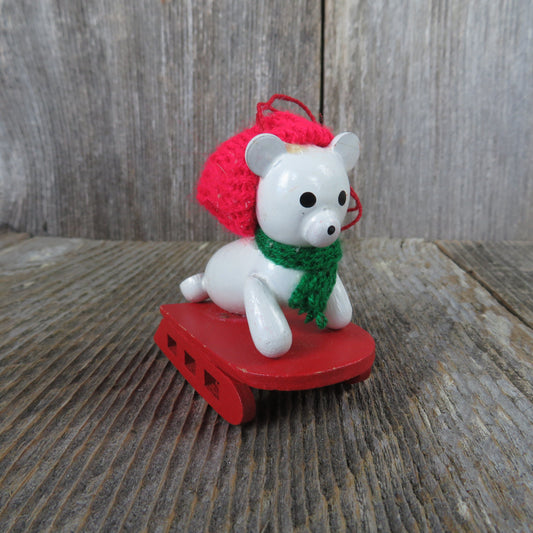 Vintage White Seal on Sled Wood Ornament Red Hat Green Scarf Red Sled Christmas