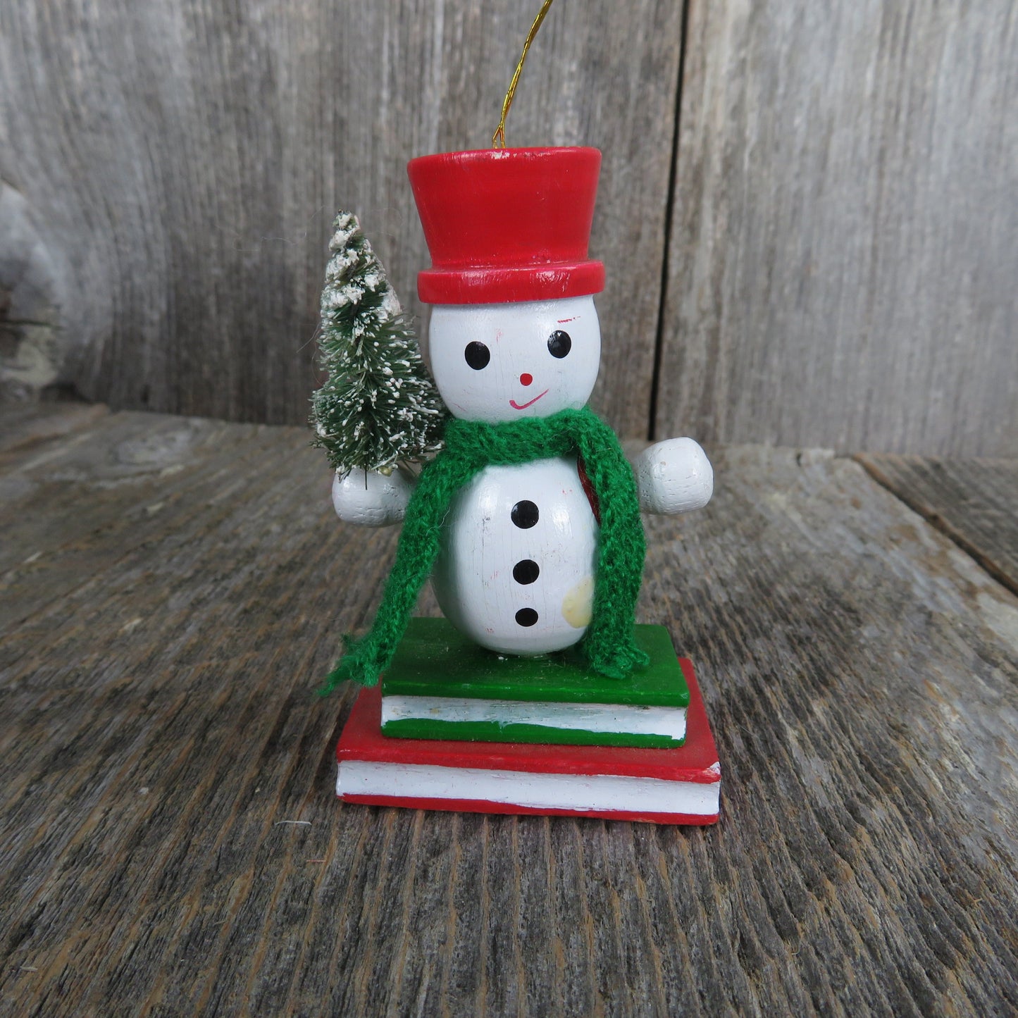 Vintage Snowman Holding Christmas Tree Wood Ornament Bottle Brush Tree Green Scarf Red Hat Vest Standing On Books Wood Taiwan