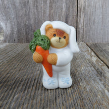 Load image into Gallery viewer, Bear in Bunny Suit Figurine Carrot Blue Bows Easter Lucy Rigg Enesco Vintage 1987