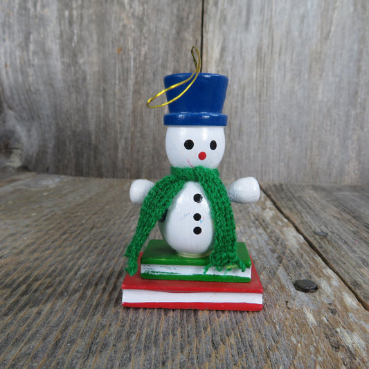 Vintage Snowman in Scarf and Blue Hat Wooden Ornament Standing On Books Wood Christmas Green Scarf Blue Vest